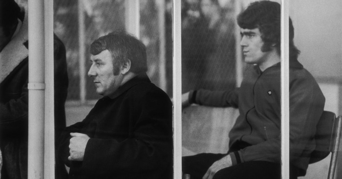 United manager Tommy Docherty (L) watches on