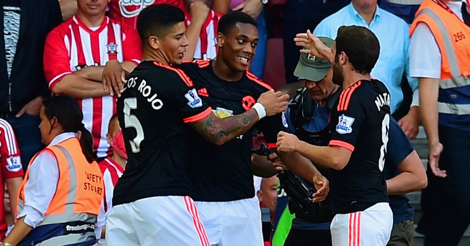 Anthony Martial (c): Celebrates his goal with Marcos Rojo and fellow scorer Juan Mata