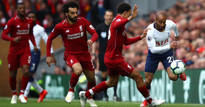 LIVERPOOL, ENGLAND - MARCH 31: Lucas Moura of Tottenham Hotspur is chased by Trent Alexander-Arnold and Mohamed Salah of Liverpool during the Premier League match between Liverpool FC and Tottenham Hotspur at Anfield on March 31, 2019 in Liverpool, United Kingdom. (Photo by Clive Brunskill/Getty Images)