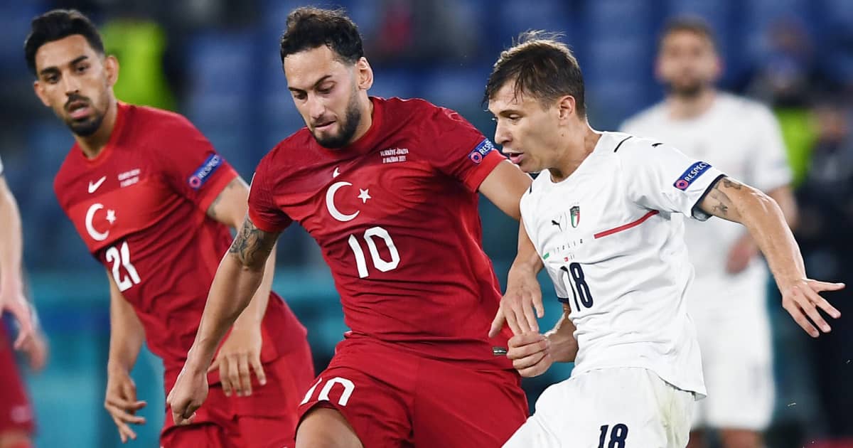 Hakan Calhanoglu tussling with Nicolo Barella, Turkey v Italy, Euro 2020, June 2021, TEAMtalk Hakan Calhanoglu tussling with Nicolo Barella, Turkey v Italy, Euro 2020, June 2021