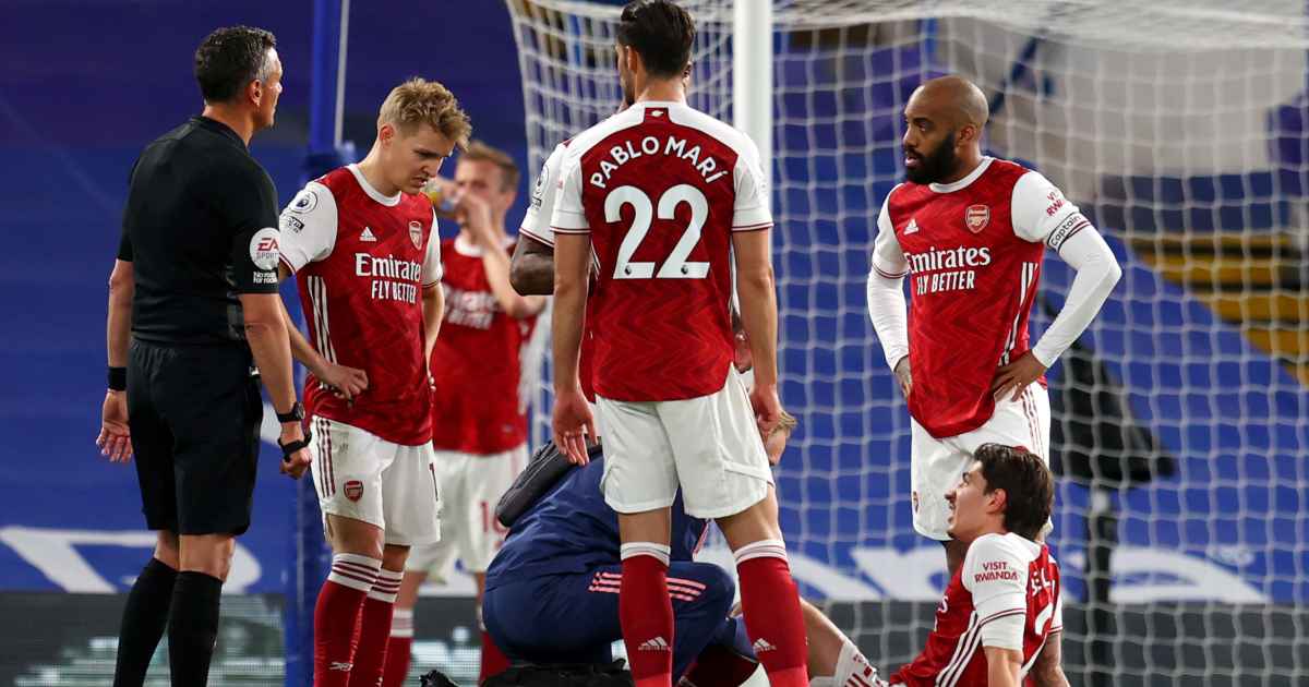 Arsenal players crowd round Hector Bellerin as he receives treatment for an injury, May 2021 Arsenal players crowd round Hector Bellerin as he receives treatment for an injury, May 2021