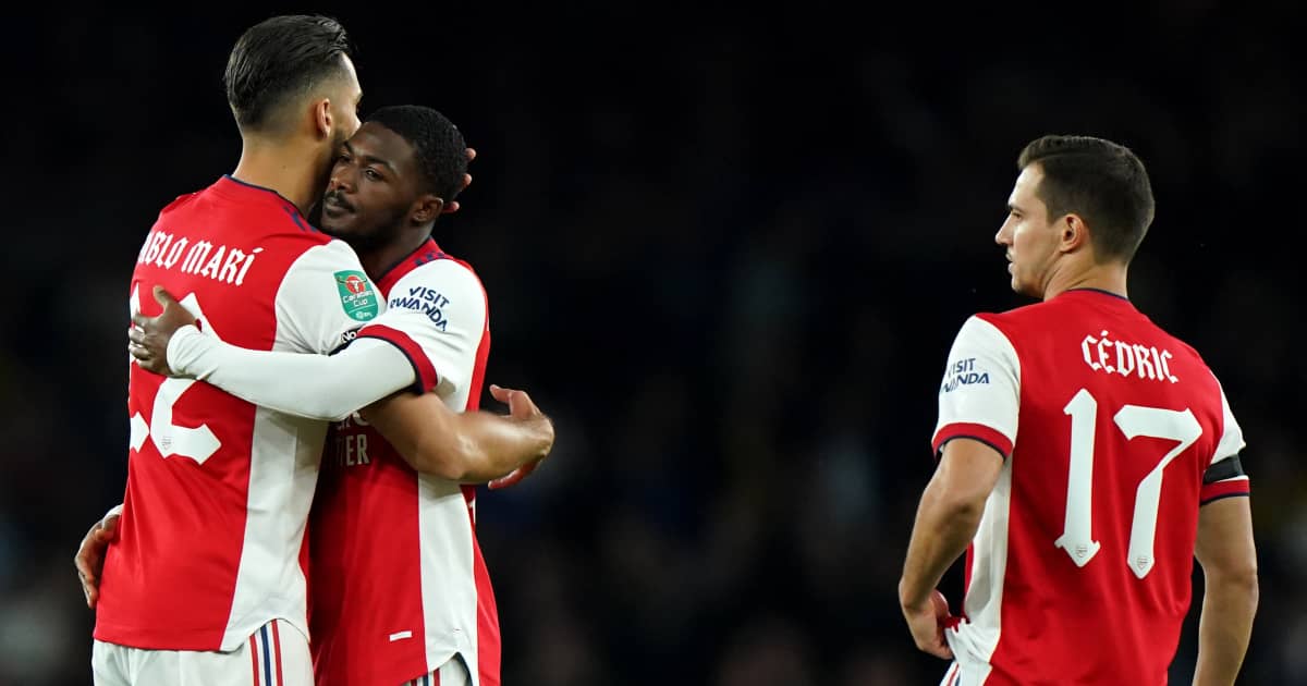Cedric Soarez watching on as Pablo Mari hugs Ainsley Maitland-Niles 2021