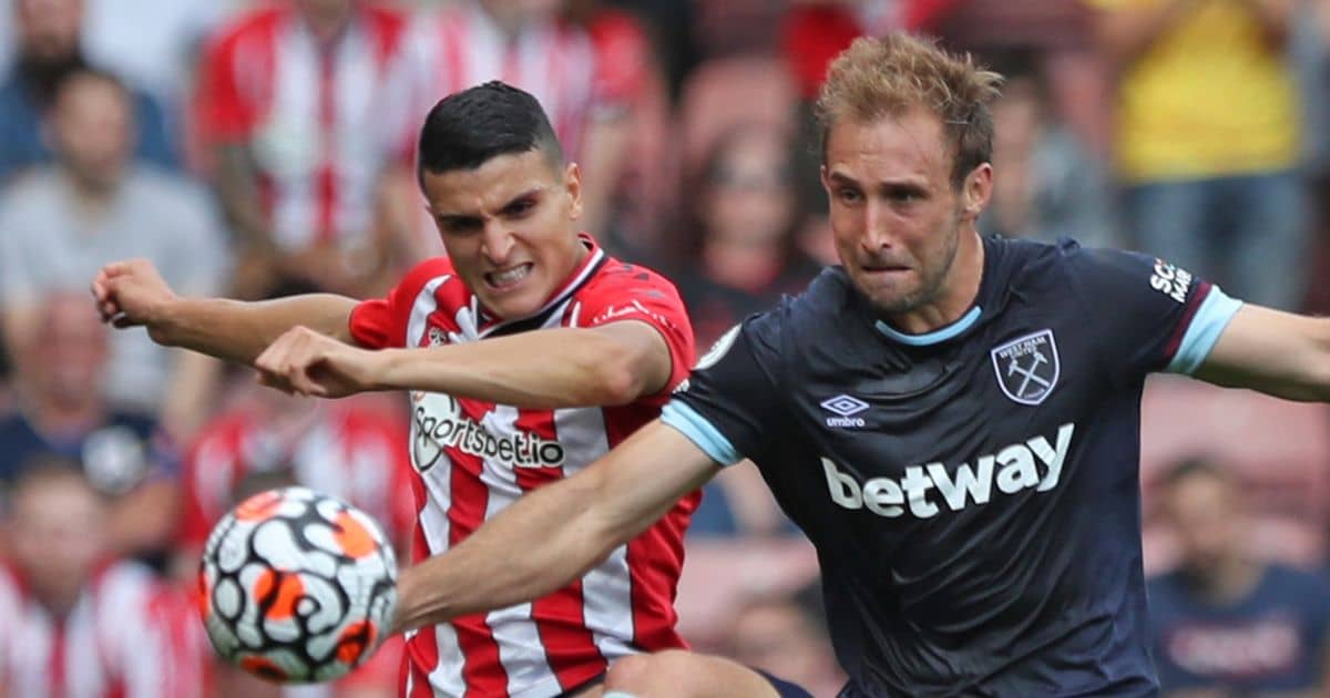 Mohamed Elyounoussi and Craig Dawson battling for the ball
