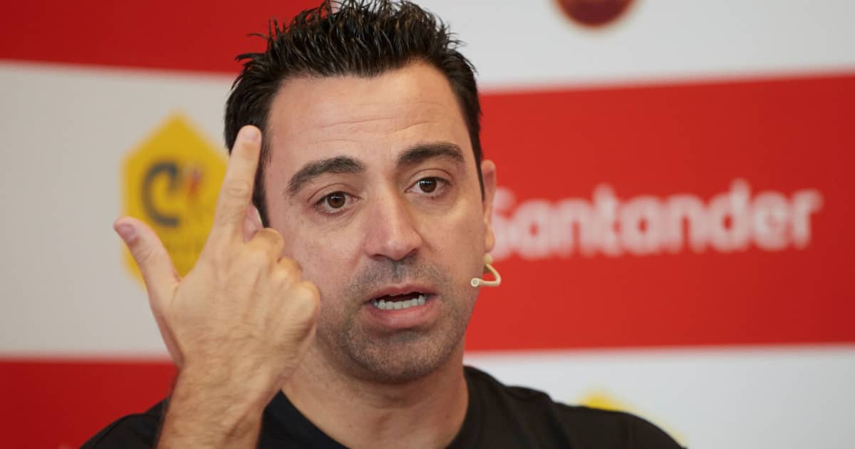 Barcelona legend Xavi Hernandez making a hand gesture during a press conference 2021