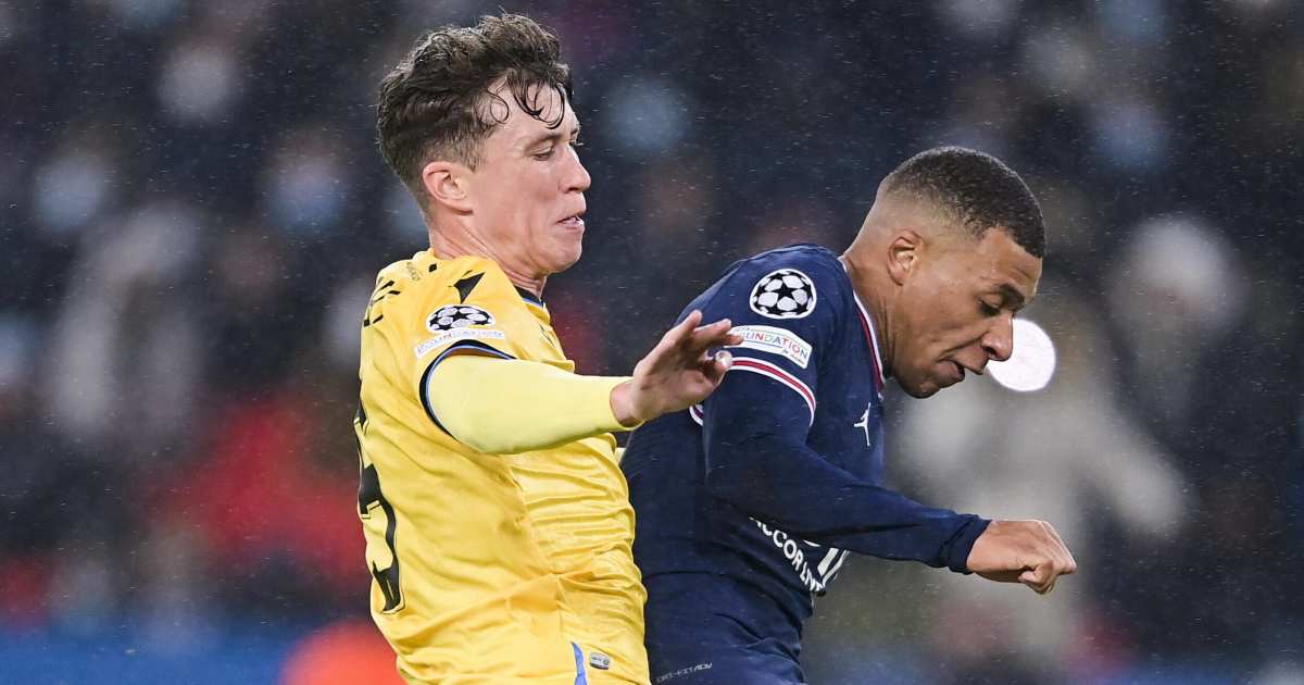 Jack Hendry challenging Kylian Mbappe in a Champions League match Jack Hendry challenging Kylian Mbappe