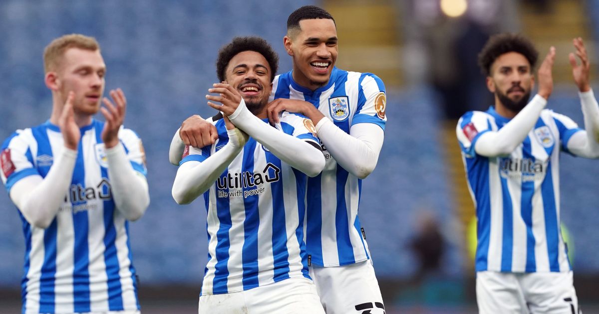 Huddersfield Town's Josh Koroma (left) celebrates with Jonathan Russell following the Emirates FA Cup third round match at Turf Moor Huddersfield Town's Josh Koroma (left) celebrates with Jonathan Russell following the Emirates FA Cup third round match at Turf Moor
