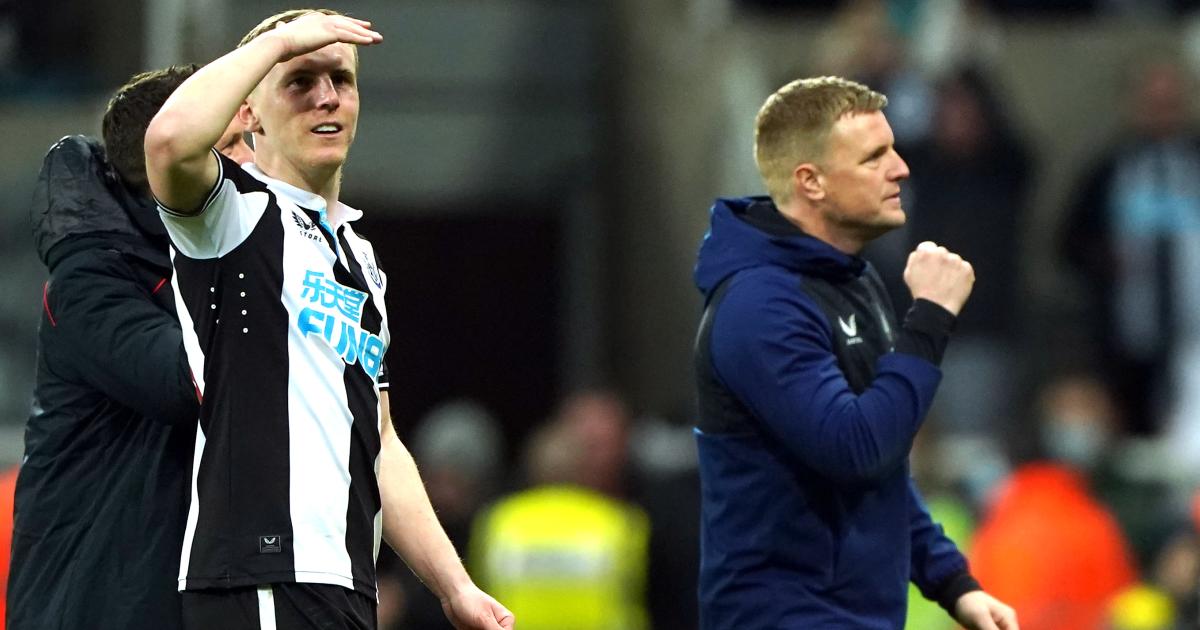 Matt Targett and Eddie Howe exit the pitch after Newcastle's win over Everton, February 2022