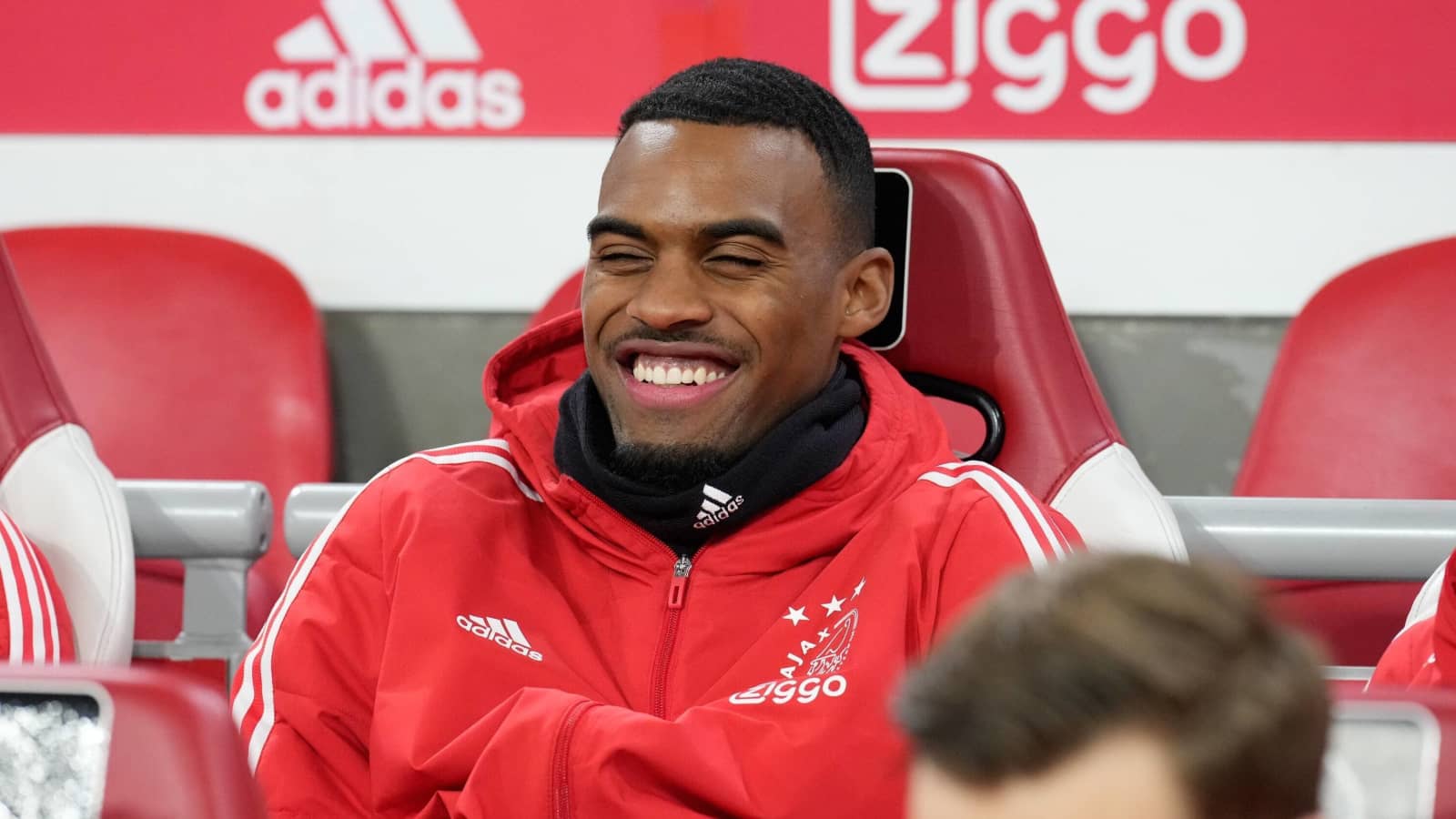 Ajax midfielder Ryan Gravenberch grinning