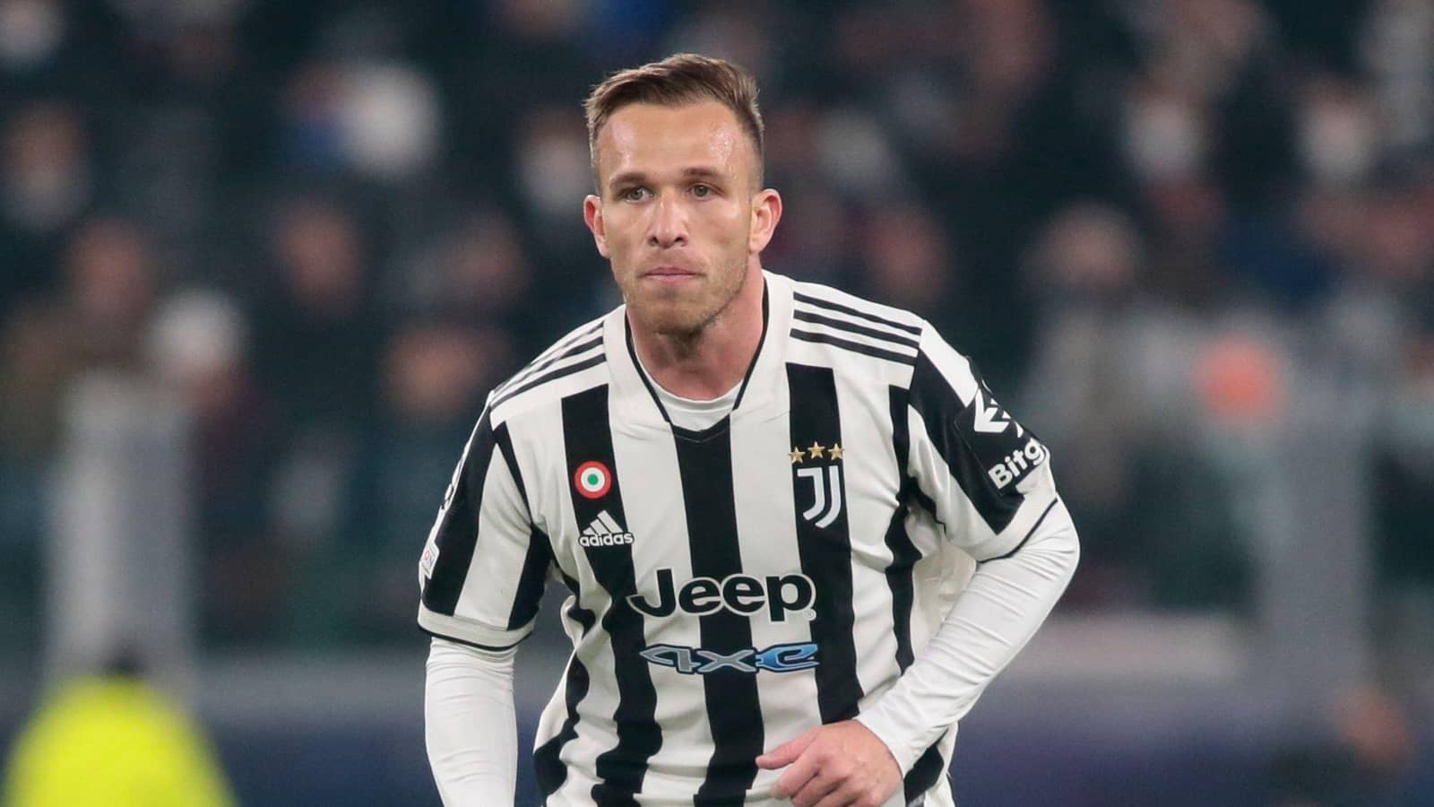 Brazilian midfielder Arthur Melo on the ball for Juventus in Champions League match Juventus player Arthur Melo