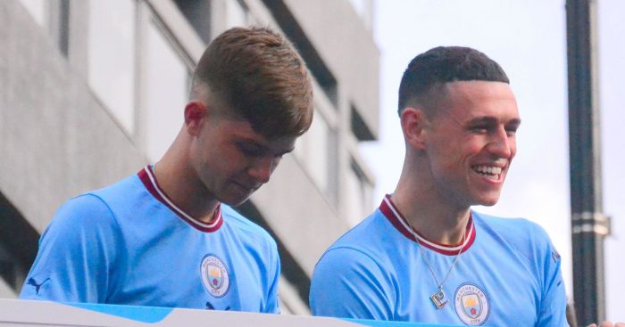 Phil Foden in centre. City players react to lively crowds. Manchester City Football Club holds a victory parade to celebrate the club's Premier League title win