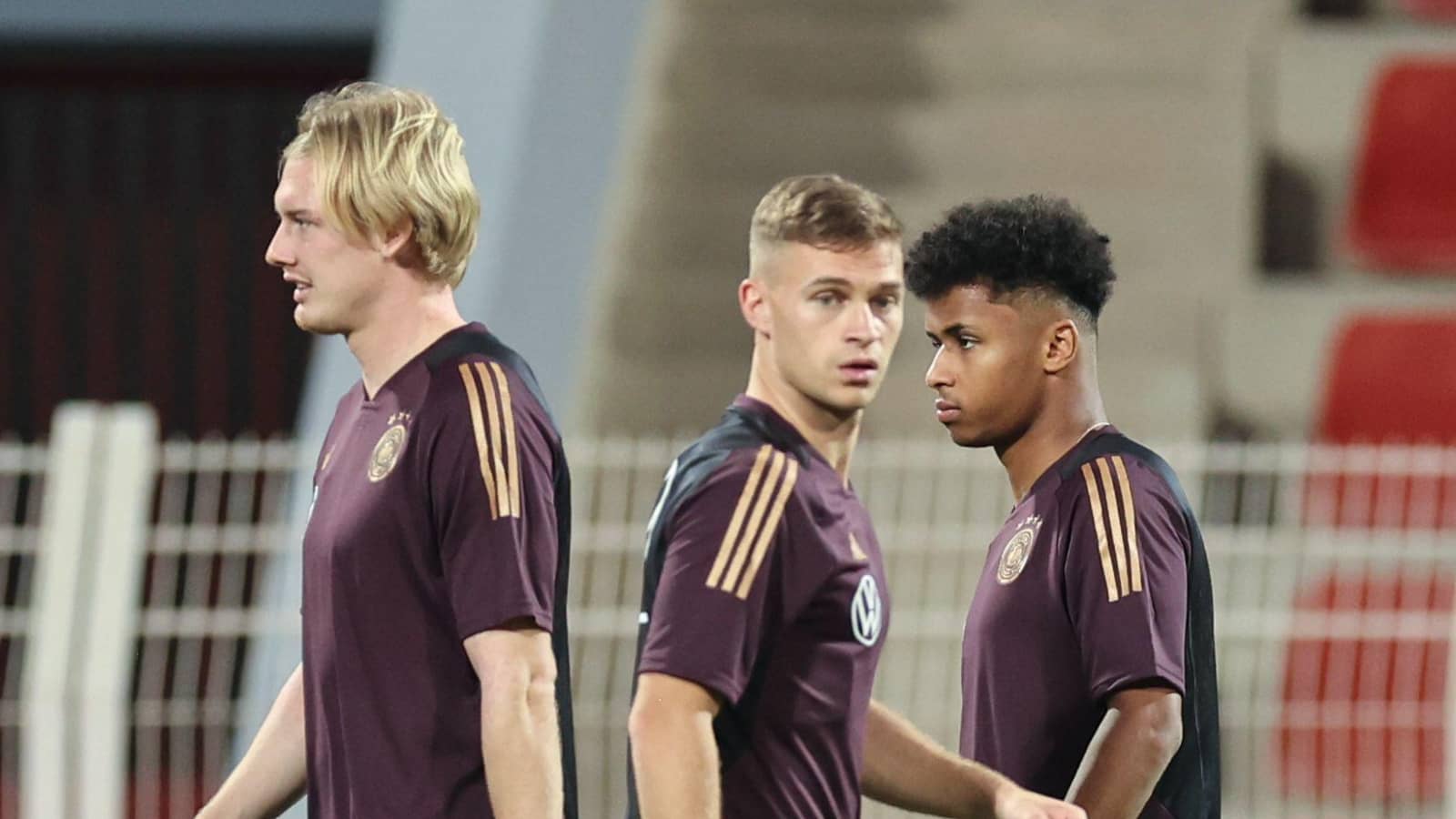 Julian Brandt. Joshua Kimmich and Karim Adeyemi of Germany
