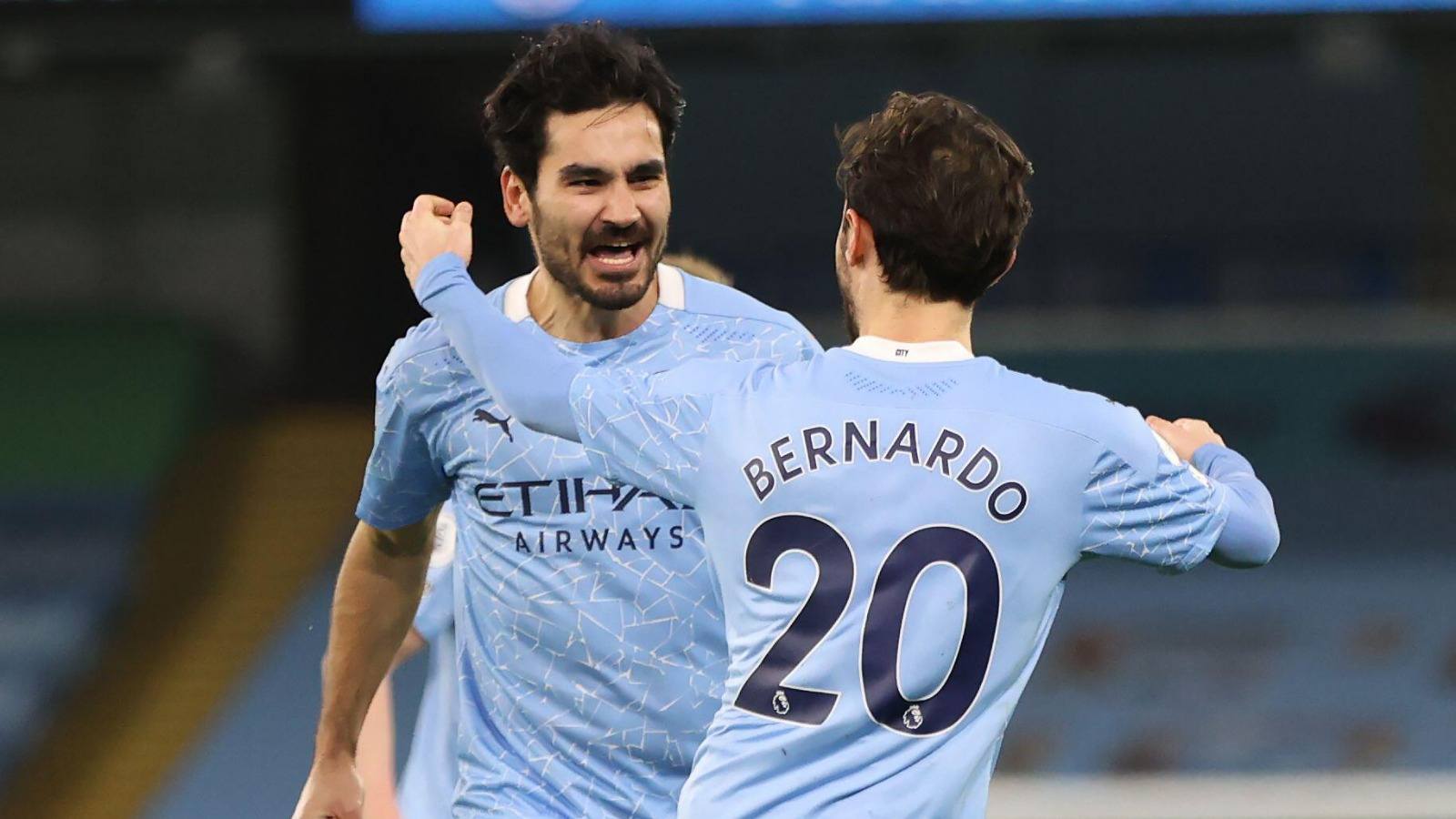 Ilkay Gundogan and Bernardo Silva of Manchester City
