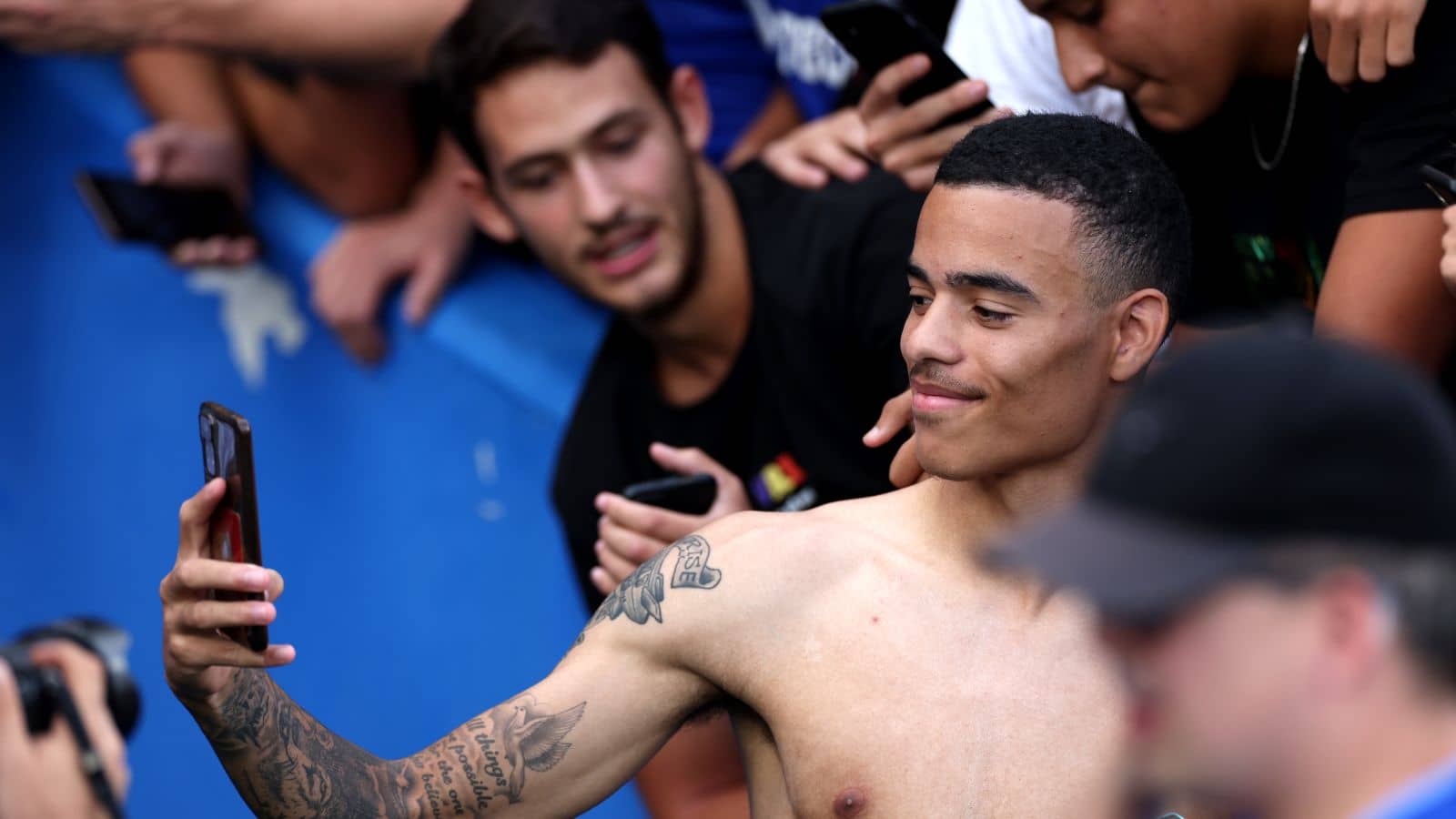 Man Utd loanee Mason Greenwood poses with Getafe fans during his loan unveiling at the LaLiga club