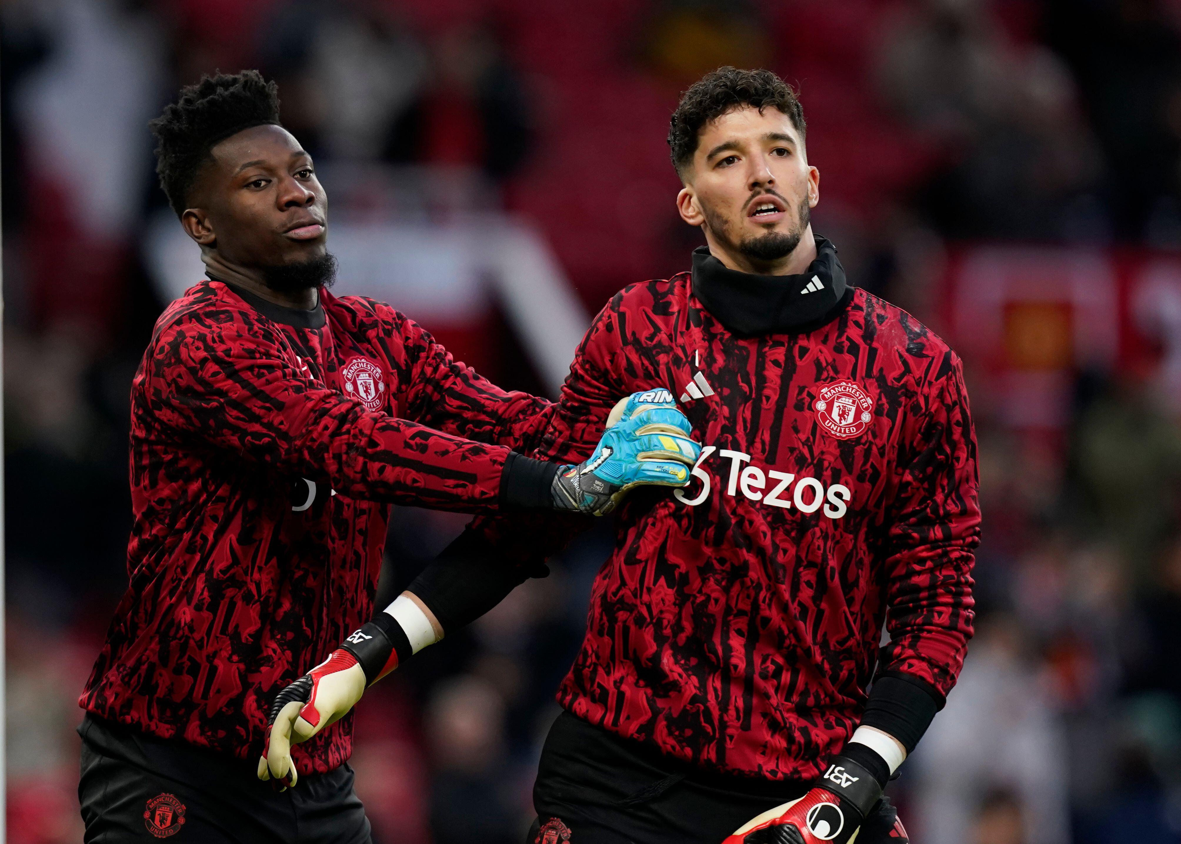 Andre Onana shoves fellow goalkeeper Altay Bayindir in the warm up ahead of Manchester United's clash with Tottenham