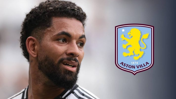 A close-up shot of Douglas Luiz in Juventus' home shirt with a prominent Aston Villa badge alongside him
