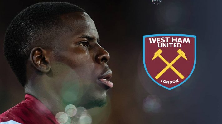 A side-profile shot of Kurt Zouma with a prominent West Ham United badge alongside him