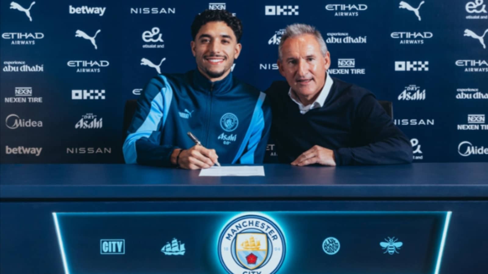 Man City sign Omar Marmoush shown here with sporting director Txiki Begiristain - pic copyright of ManCity.com