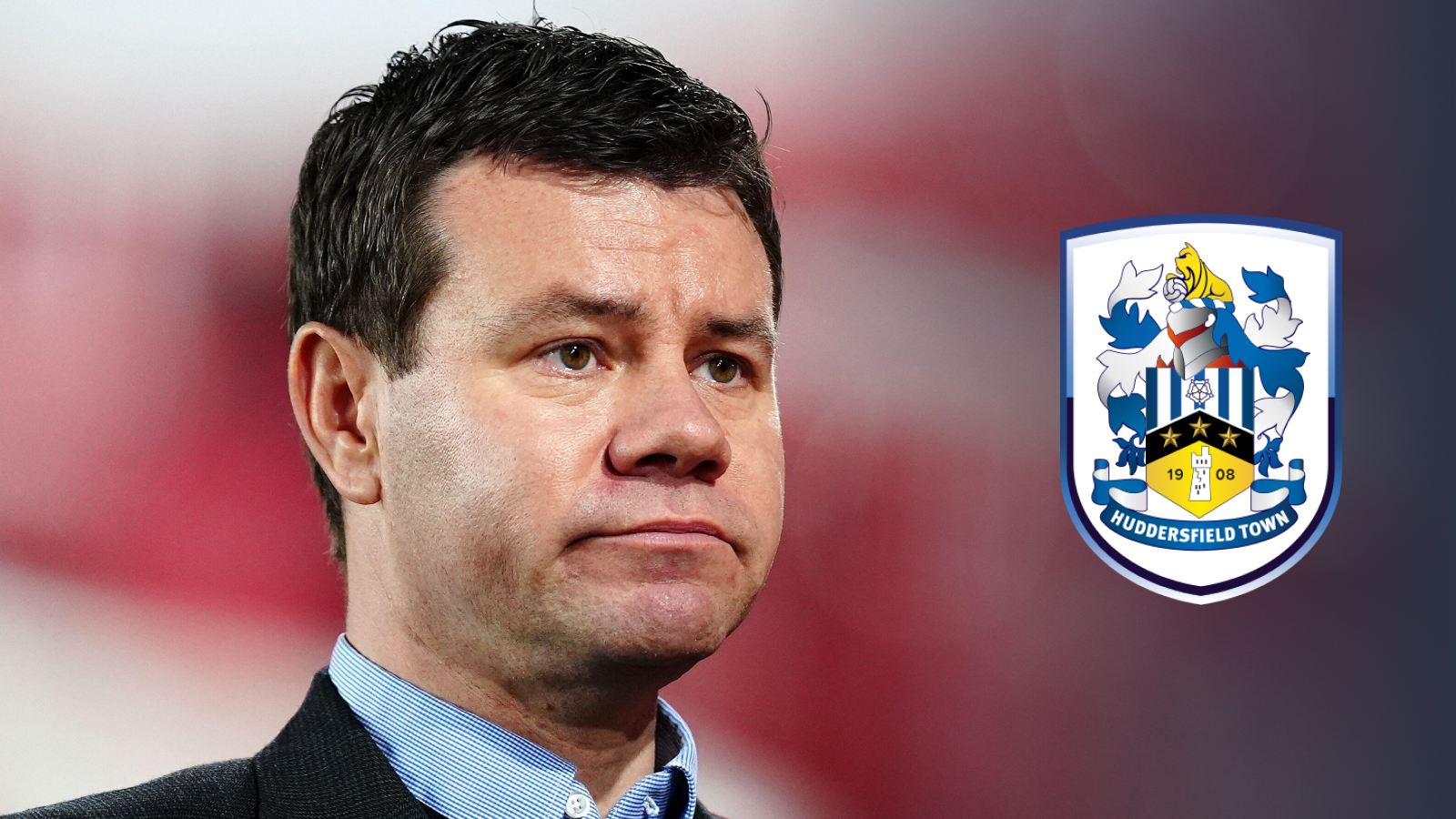 Nottingham Forest Chief Football Officer Ross Wilson with a Huddersfield Town badge
