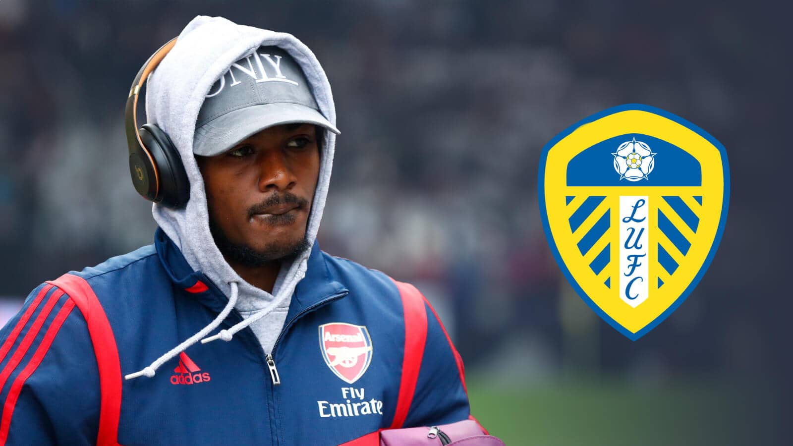 Former Arsenal star Ainsley Maitland-Niles next to the Leeds United club crest