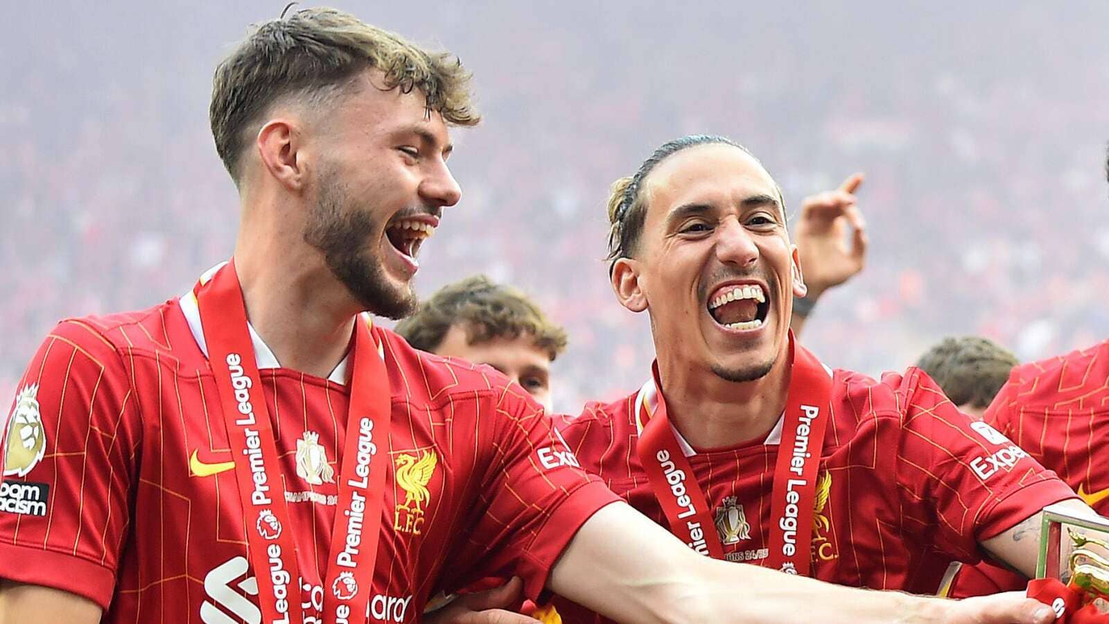 Conor Bradley and Kostas Tsimikas celebrating with Liverpool
