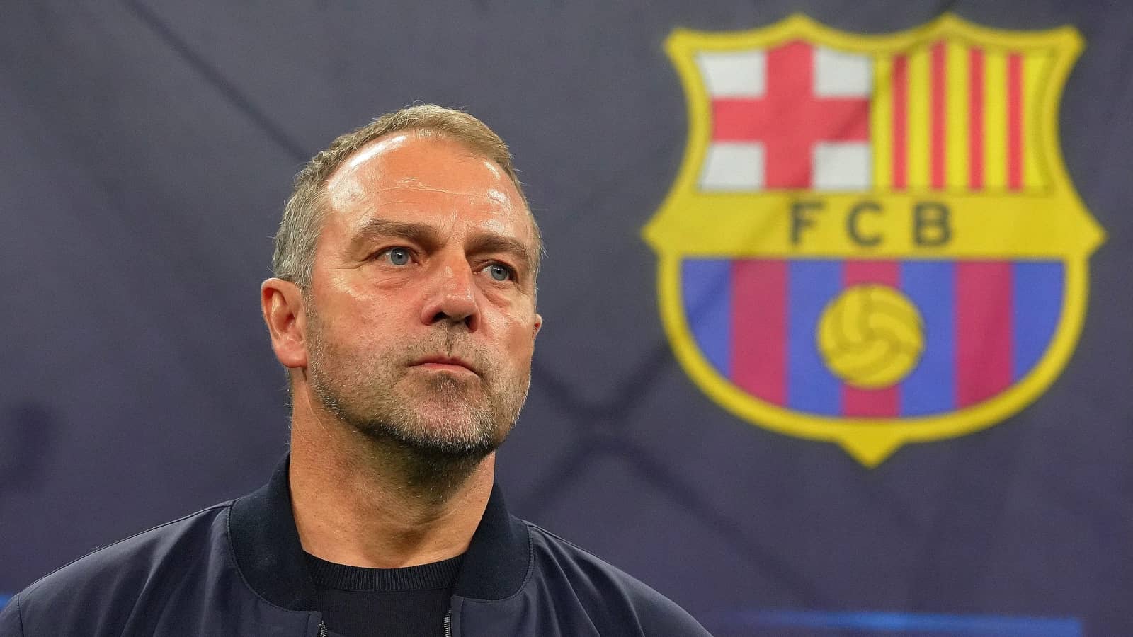 Hansi Flick with Barcelona badge