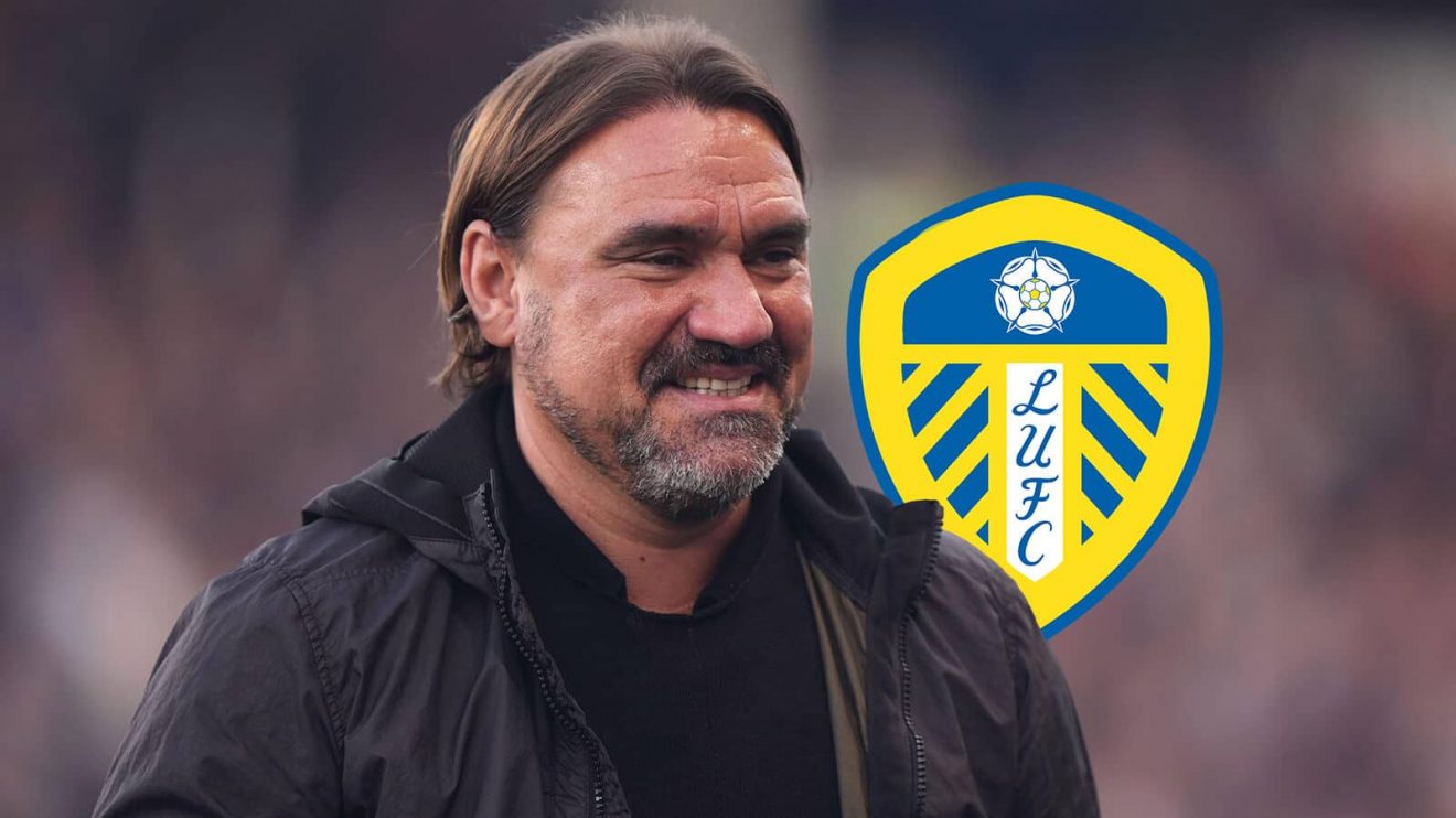 Leeds United manager Daniel Farke next to the Leeds United badge - copyright TEAMtalk