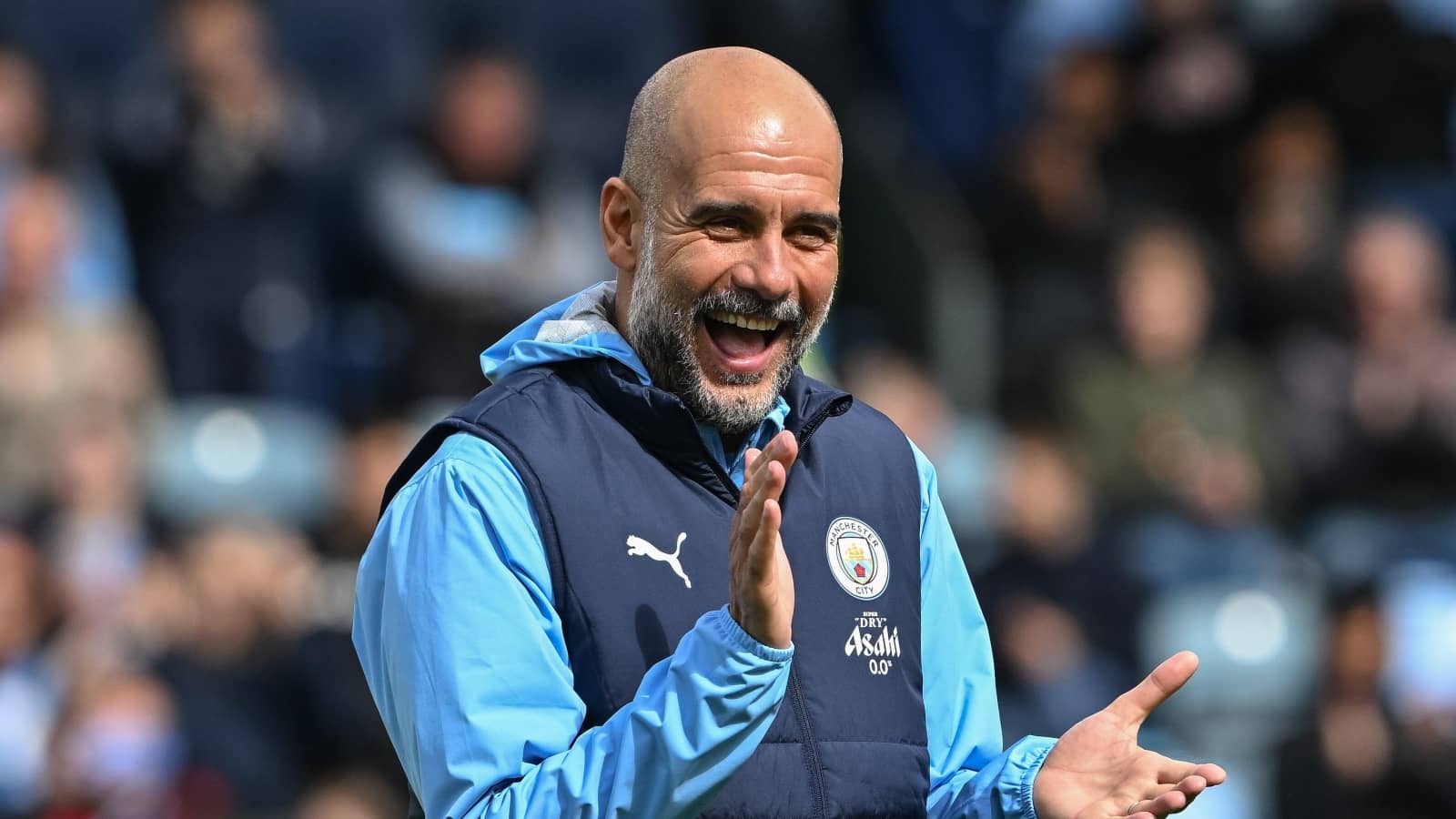 Pep Guardiola laughs before Man City game
