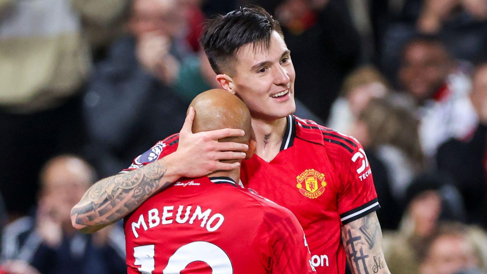 Benjamin Sesko celebrates with Bryan Mbeumo.
