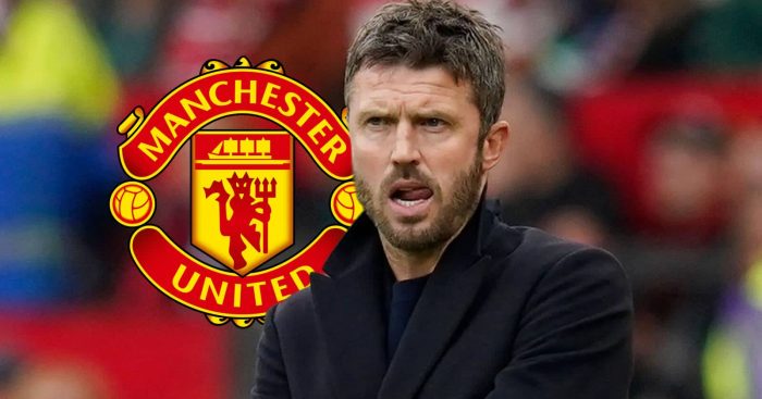 Manchester United interim-manager Michael Carrick next to the Manchester United badge - copyright TEAMtalk