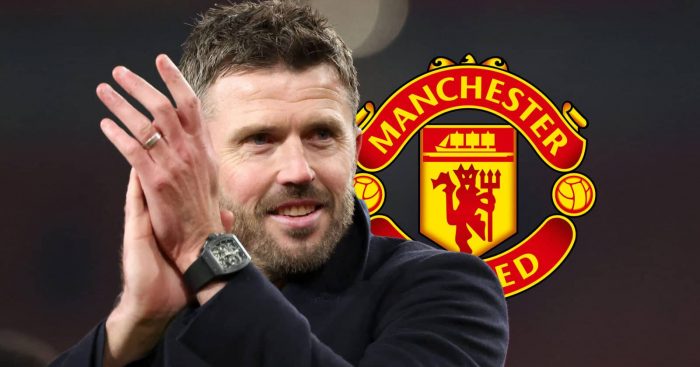 Manchester United manager Michael Carrick next to the Manchester United badge - copyright TEAMtalk
