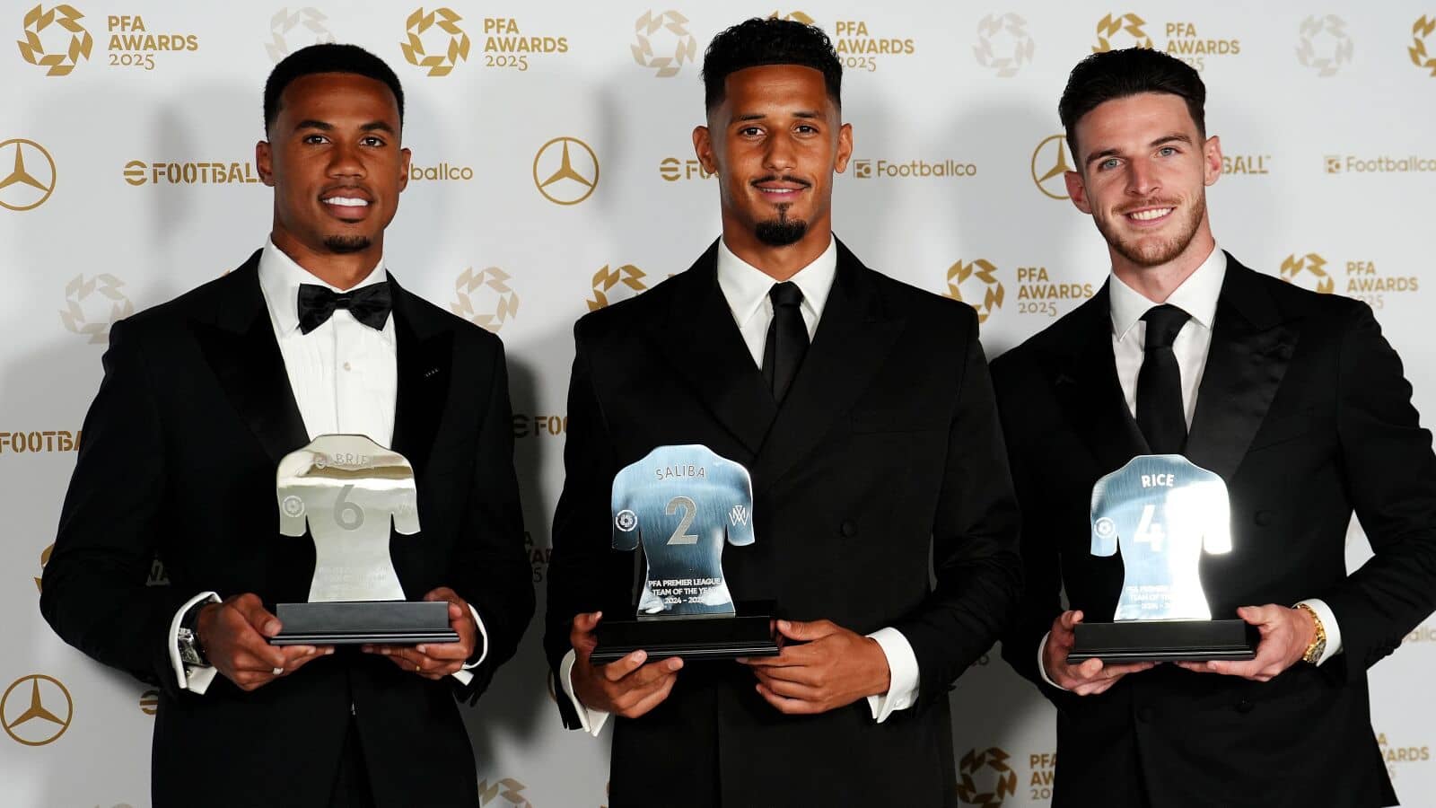 Gabriel Magalhaes, William Saliba and Declan Rice of Arsenal celebrate with their 2025 Team of the Year entries