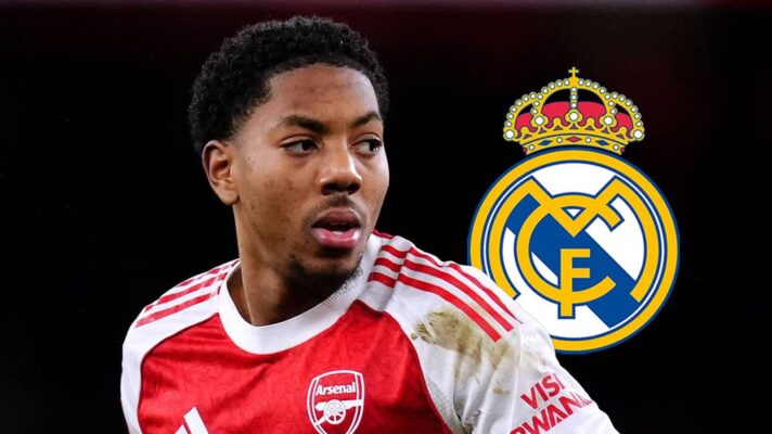 Arsenal left-back Myles Lewis-Skelly next to the Real Madrid badge - copyright TEAMtalk