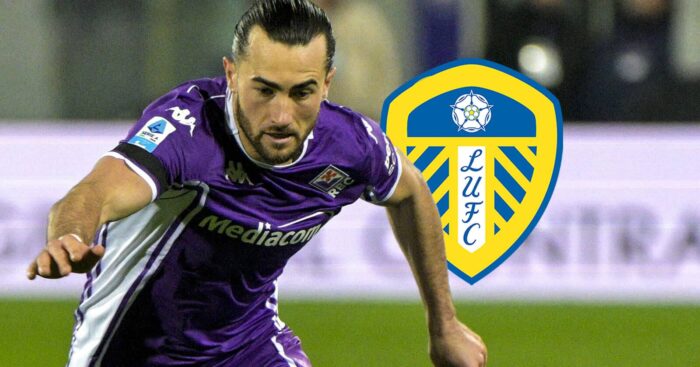 Fiorentina loanee Jack Harrison next to the badge of parent club, Leeds United