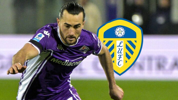 Fiorentina loanee Jack Harrison next to the badge of parent club, Leeds United