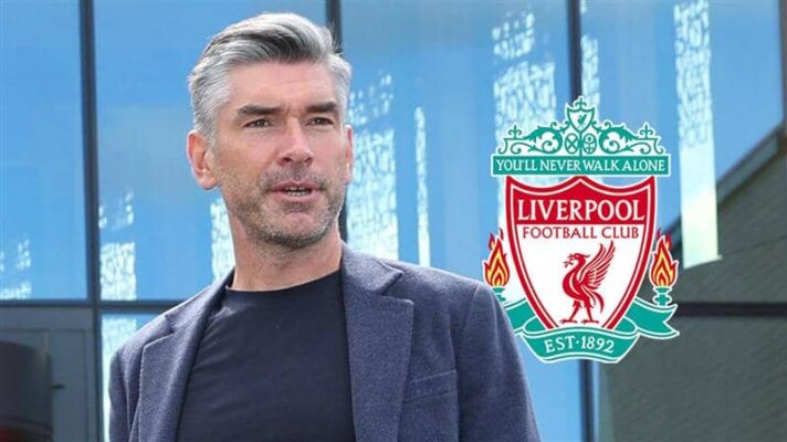 Liverpool sporting director Richard Hughes next to the Liverpool badge - TEAMtalk