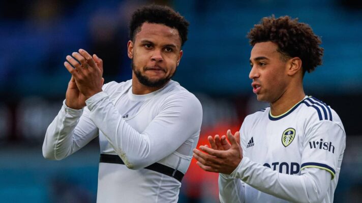 Weston McKennie and Tyler Adams, both formerly of Leeds United applaud the fans at Elland Road