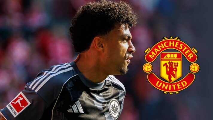 Nathaniel Brown with the Manchester United badge