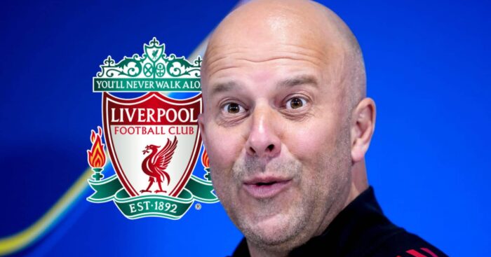 A surprised looking Liverpool manager Arne Slot next to the Liverpool FC badge