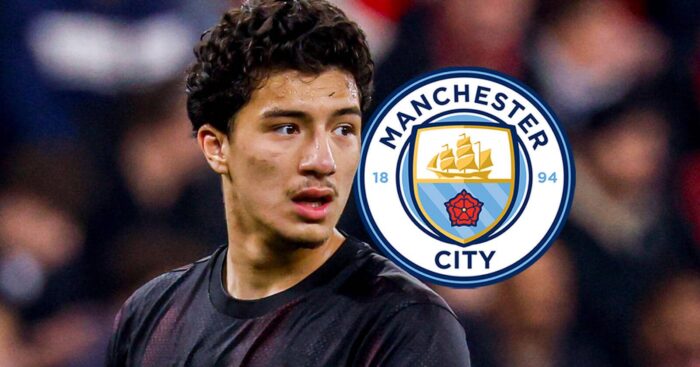 Bayer Leverkusen's Ibrahim Maza with a Man City badge