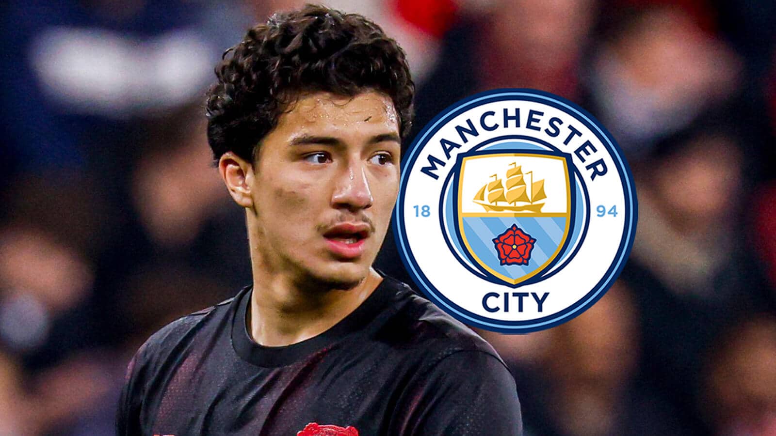 Bayer Leverkusen's Ibrahim Maza with a Man City badge
