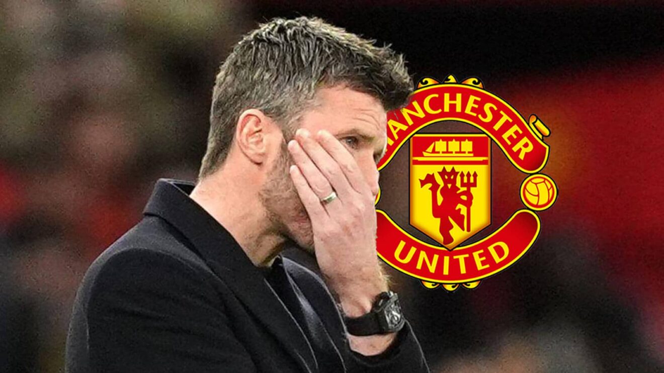 Manchester United interim boss Michael Carrick next to the Manchester United badge