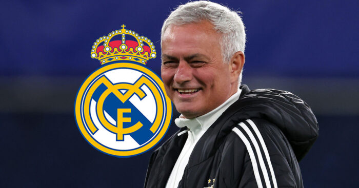 Jose Mourinho with Real Madrid badge