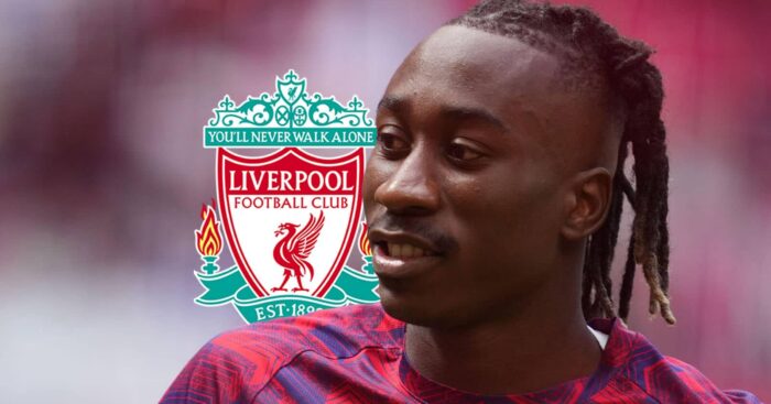 RB Leipzig winger Yan Diomande next to the Liverpool FC badge