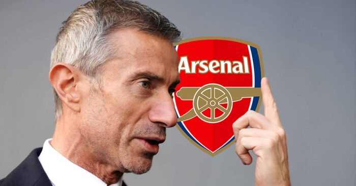 Arsenal sporting director Andrea Berta next to his club's badge