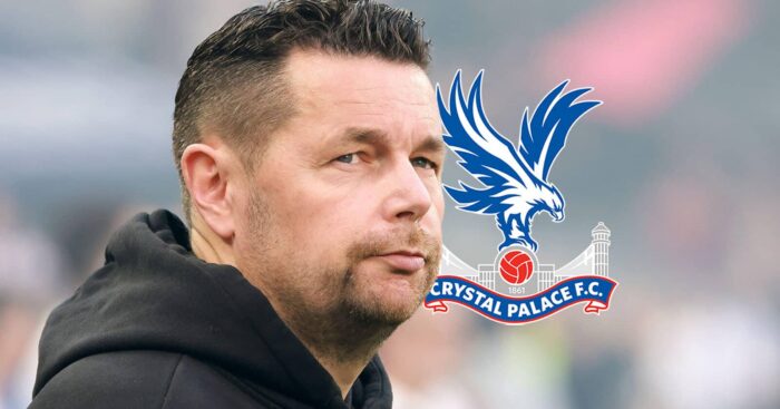 Lens boss Pierre Sage next to the Crystal Palace badge