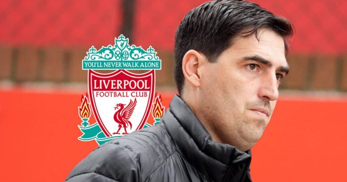 Liverpool boss Andoni Iraola next to the club badge