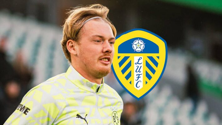 Former Borussia Dortmund star Julian Brandt next to the Leeds United badge