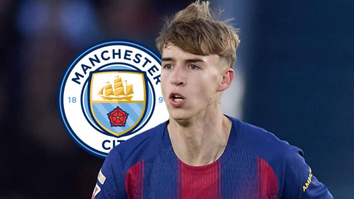 Barcelona star Tommy Marques with a Man City badge