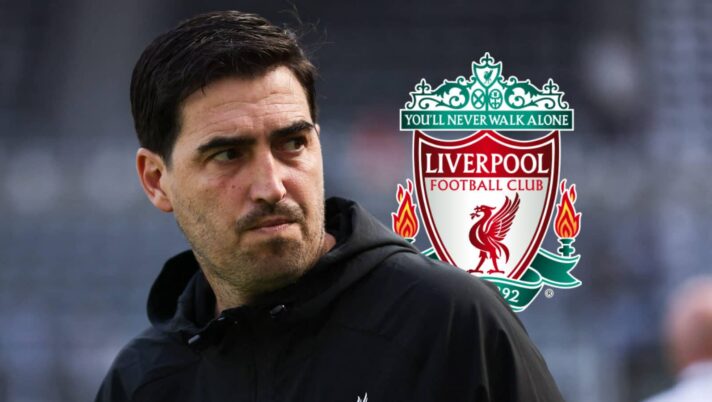 Liverpool manager Andoni Iraola next to the club badge