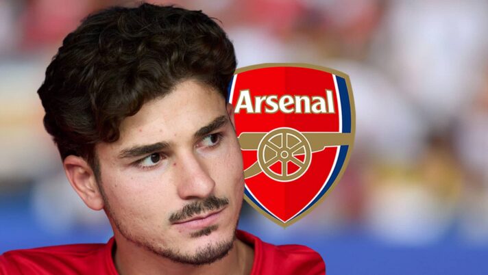 Atletico Madrid strike Julian Alvarez next to the Arsenal badge
